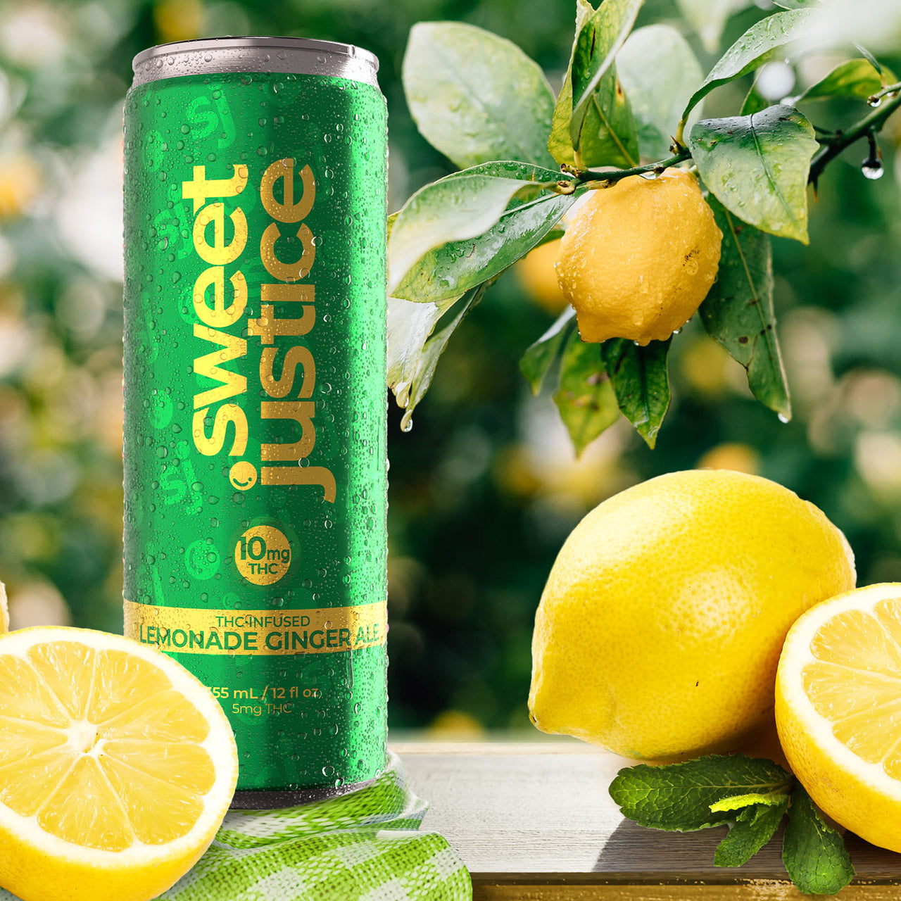Sweet Justice Lemonade Ginger Ale single can in foreground with lemon tree in background